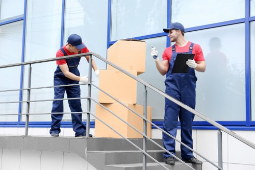 Professional movers loading household items in central Westminster