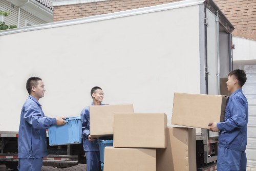 Loading furniture into a removal van in central Westminster