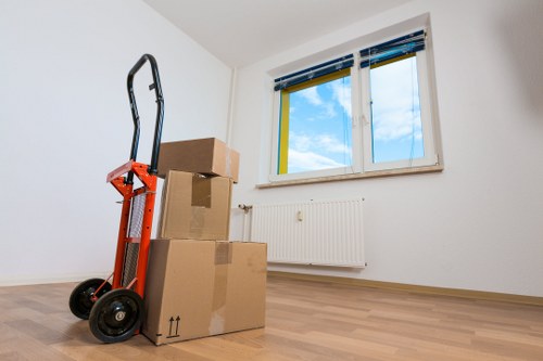 Van moving boxes and furniture near Westminster properties
